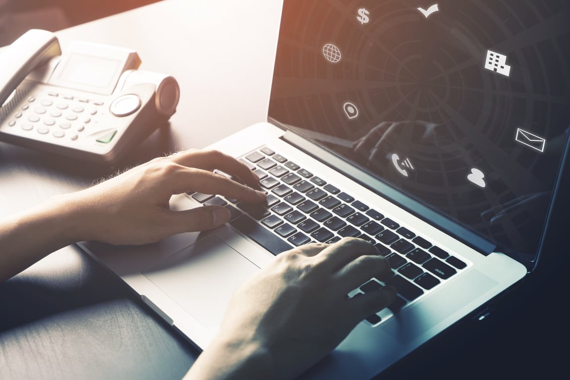 Man is using Internet on Computer for online travel agency